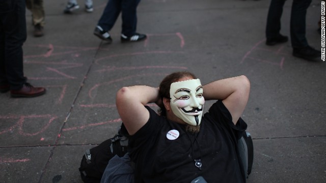 An Occupy protester wears a Guy Fawkes mask during a May Day demonstration on May 1, 2012, in Oakland, California. The mask has become a symbol of the Occupy movement.