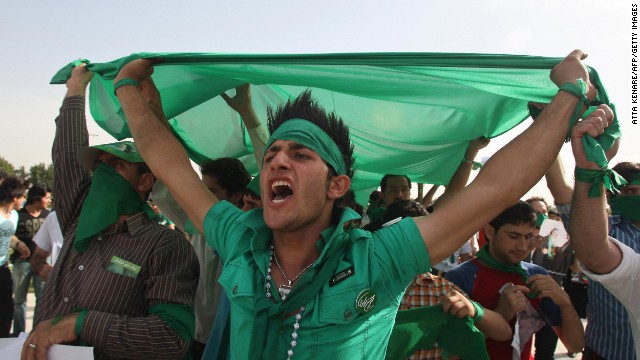 Supporters of Iranian presidential candidate Mir Hossein Mousavi shout slogans during a street campaign rally at Azadi Square in Tehran on June 10, 2009. The color green became a symbol of solidarity in the protests that followed the country's 2009 elections.