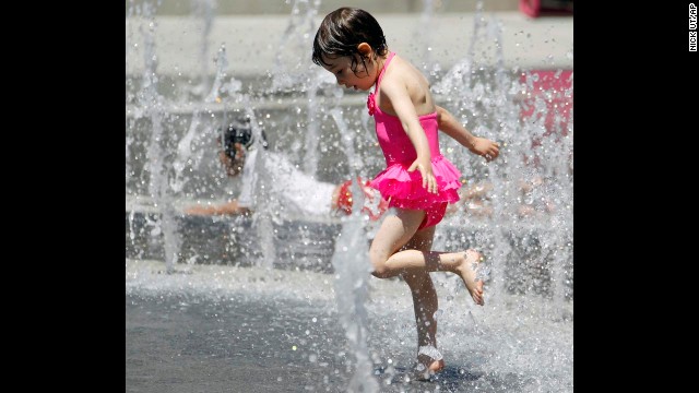 Betty Lu Guapo, 4, cools off at the Los Angeles Fountain on June 27.