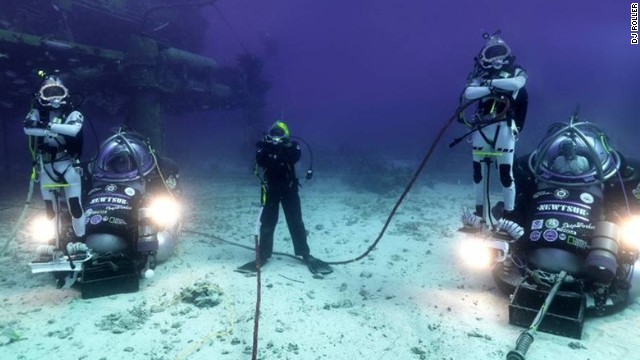 With their high-tech scuba gear and futuristic motorbikes, this team of five divers look like something from an outer space mission. In fact, they're part of an ambitious project to live underwater for 31 days.