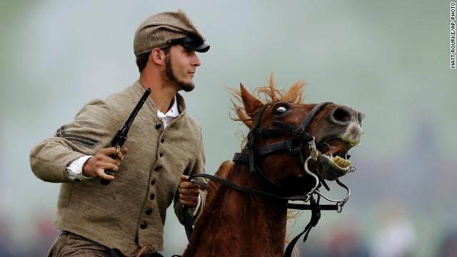 A mounted Confederate reenactor takes part in a demonstration. Besides portrayals of the fighting, the reenactment includes about 200 individuals representing the townspeople of Gettysburg in 1863.