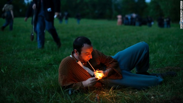 A Union soldier with Murray's Brigade lights his pipe at Bushey Farm in Gettysburg on Thursday, June 27. 