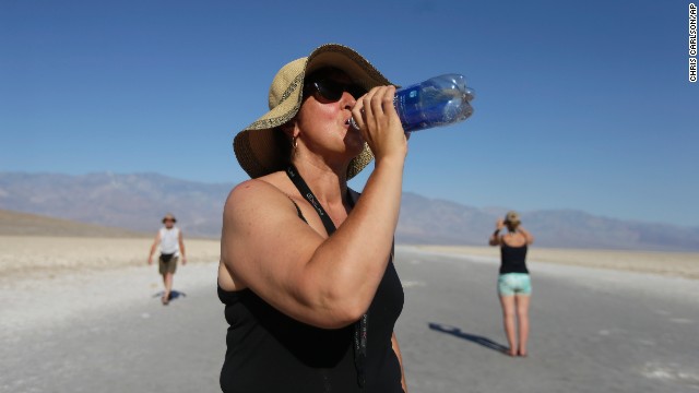 Maria Wieser of Italy takes a drink of water while sightseeing in Death Valley National Park in California on June 28. 