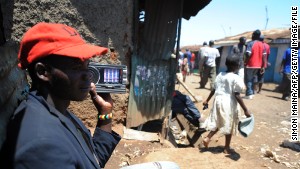 A man listens to a radio in the huge Kibera slum in Nairobi, Kenya, where Kennedy Obede grew up. 