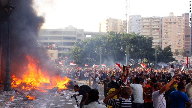 Anti-Morsy demonstrators burn the contents from an office for Morsy's Freedom and Justice Party, the political wing of the religiously conservative Muslim Brotherhood, in the coastal city of Alexandria on Friday, June 28.