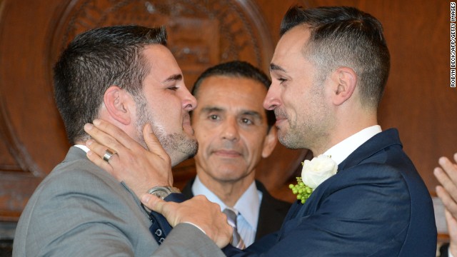 Jeff Zarillo, left, and Paul Katami, plaintiffs in the California case against Proposition 8, react after they are married by Los Angeles Mayor Antonio Villaraigosa at Los Angeles City Hall on June 28.