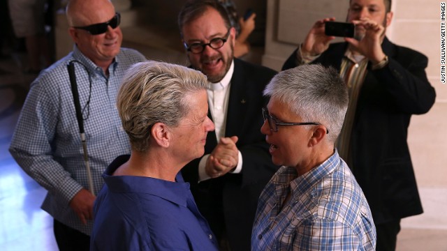 Suzanne Hufft, left, and Val Robb exchange vows as they are married at San Francisco City Hall on June 28.