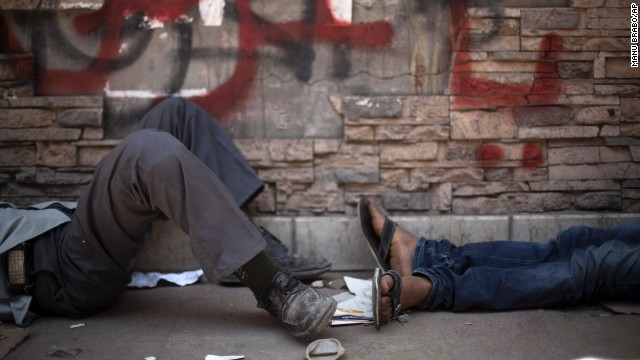 Protesters take a rest near Tahrir Square on June 30.