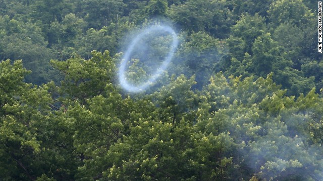 A smoke ring from a cannon fired by Confederate Civil War reenactors wafts skyward on June 30.