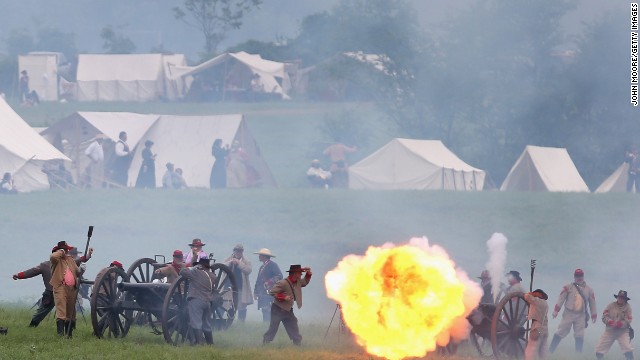 A ball of flame erupts from a Confederate canon during the reenactment on June 30. 