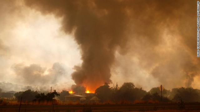 A wildfire destroys homes in the Glenn Ilah area near Yarnell on June 30.