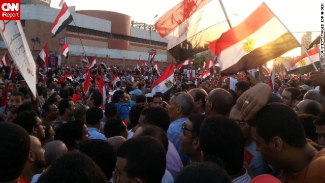 <a href='http://ireport.cnn.com/docs/DOC-997886'>iReporter Maged Eskander </a>was also in Cairo Sunday afternoon and captured these images of protesters outside the presidential palace, where demonstrators calling for the ousting of President Mohamed Morsy had gathered. "[There were] songs from houses, flags from balconies [and] fireworks," he said. "People were happy, the numbers were huge and filling more and more streets." He says protesters hope the marches will bring "hope again to all Egyptians ... not to one group." 