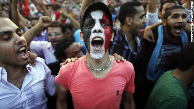 Egyptians shout slogans against Morsy in Cairo on Monday, July 1.