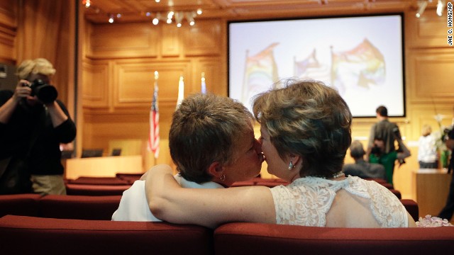 Faith Kassan, left, and her partner, Jennifer Ehrman, kiss before their wedding ceremony in West Hollywood on July 1.