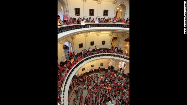 Demonstrators on both sides gather in the Capitol on July 1.