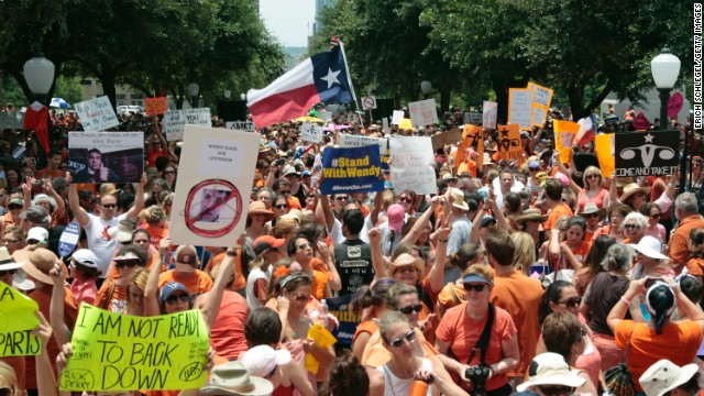 Women's rights demonstrators gather at the capitol in Austin on July 1.