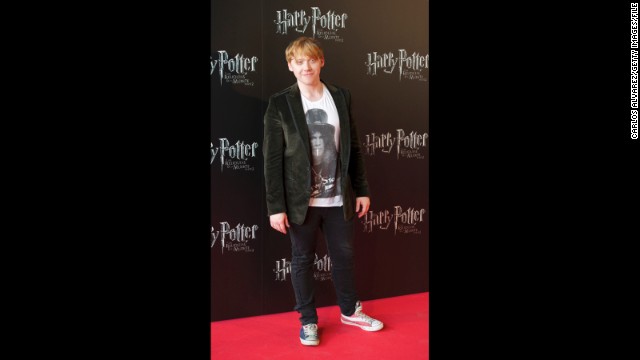 Rupert Grint walks the red carpet in red, white and blue sneakers at the Madrid, Spain, premiere of "Harry Potter and the Deathly Hallows: Part 2" in June 2011. 