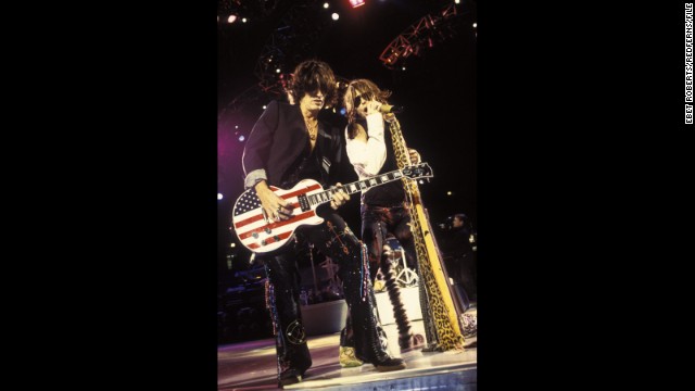 Aerosmith's Joe Perry rocks out on a stars and stripes Gibson Les Paul guitar with Steven Tyler at Madison Square Garden in November 2001.