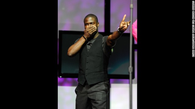 The comedian peaks onstage during the ninth annual Ford Hoodie Awards at the Mandalay Bay Events Center on August 13, 2011, in Las Vegas. 