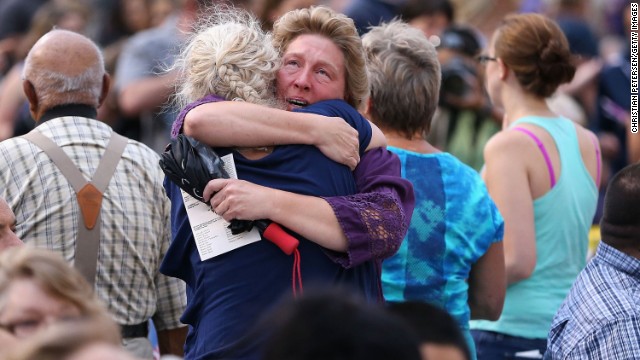 Family members of victims hug as they arrive at a vigil at Prescott High School on July 2. <a href='http://www.cnn.com/2013/07/02/us/gallery/hot-shot-victims/index.html'>The elite team members' deaths</a> on Sunday, June 30, marked the deadliest day for U.S. firefighters since the 9/11 attacks.