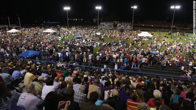 People attend a candlelight vigil at Prescott High School on July 2.