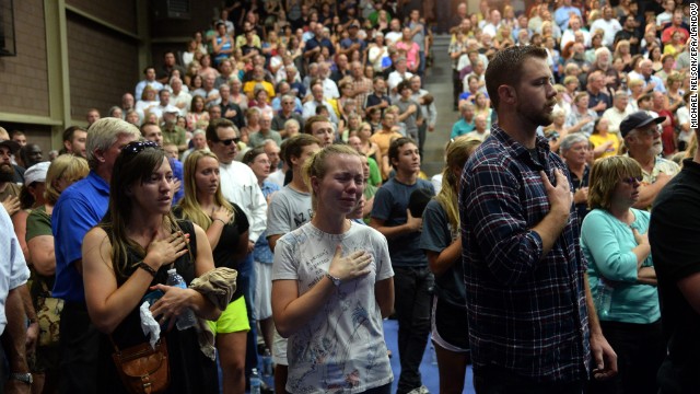 People gather at a memorial service for the firefighters at Embry-Riddle Aeronautical University in Prescott on Monday, July 1.