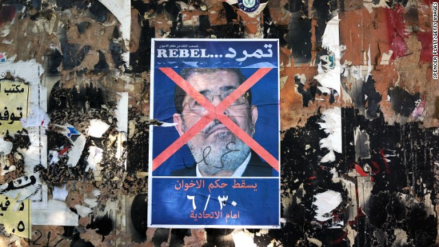 An anti-Morsy poster is displayed on a wall in Tahrir Square on July 3.