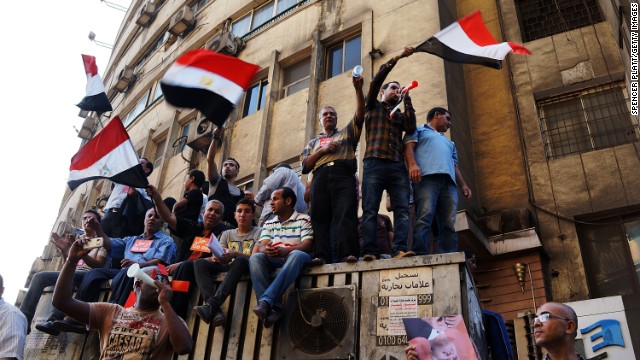 Thousands of Egyptian protesters celebrate in Tahrir Square as the deadline given by the military to Morsy passes on July 3.