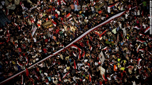 People celebrate at Tahrir Square after a broadcast on July 3 confirming that the Egyptian Army will temporarily be taking over.