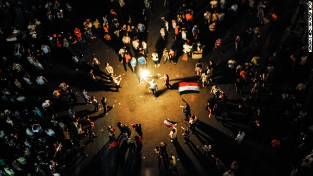 Protesters celebrate near Egypt's Presidential Palace in Cairo on July 3.