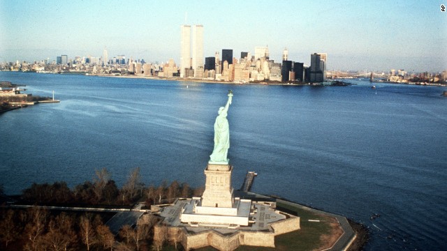 The New York Harbor and World Trade Center are shown behind the Statue of Liberty in 1980.