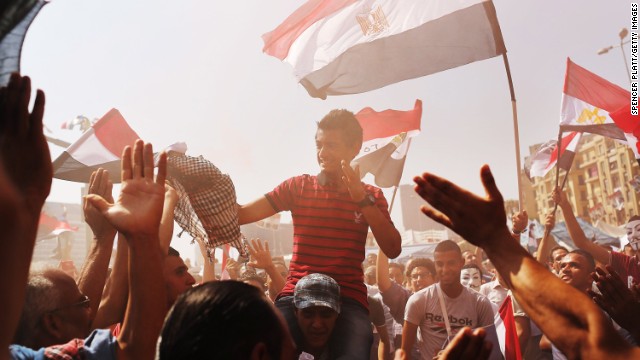 People dance and cheer at Tahrir Square in Cairo on July 4.