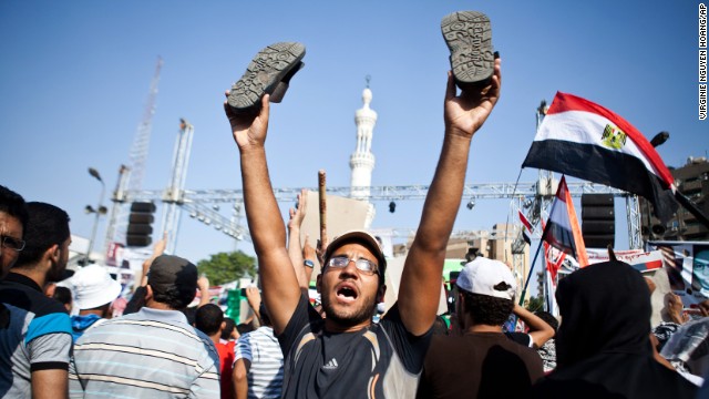 A Morsy supporter reacts as a military helicopter flies over during a July 4 rally in Nasr City.