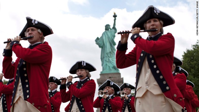 Members of the Old Guard attend the reopening ceremony of the Statue of Liberty, marking the first day it opened to the public after being shuttered by Superstorm Sandy in October.