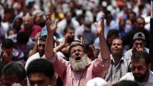 Morsy supporters pray near the University of Cairo in Giza on July 5.