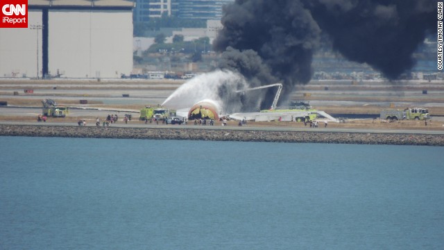 iReporter Timothy Clark was standing on the eighth floor of the Embassy Suites Airport Hotel when he heard a loud crashing sound from outside. 'My daughter told me she heard a plane crash. I used my camera to get a clearer view and I could see a dust cloud. Then people running from the plane, then flames," he said.