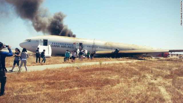 David Eun, a passenger on Asiana Airlines Flight 214, posted this image to Path.com along with the message, "I just crash landed at SFO. Tail ripped off. Most everyone seems fine, I'm ok. Surreal..." It was one of the first photographs taken after the crash.