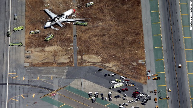 Rescue workers tend to the crash site on July 6.