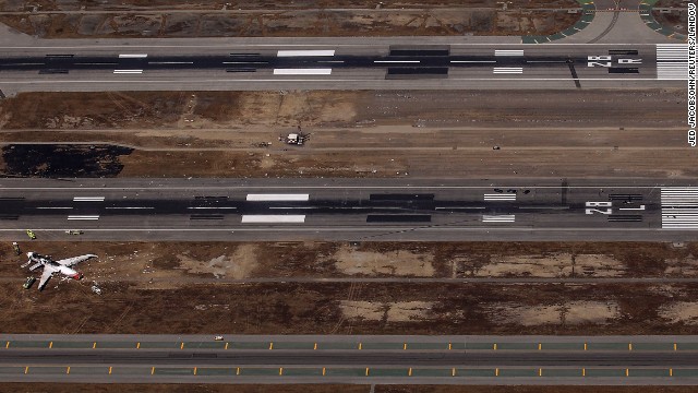 An aerial view shows the site of the crash landing between the runways on July 6.