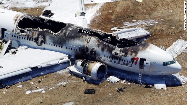 Asiana Airlines Flight 214 remains on the runway on July 6.