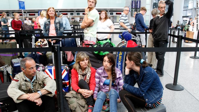 Passengers wait for the British Airways counter to reopen at San Francisco International Airport on July 6.