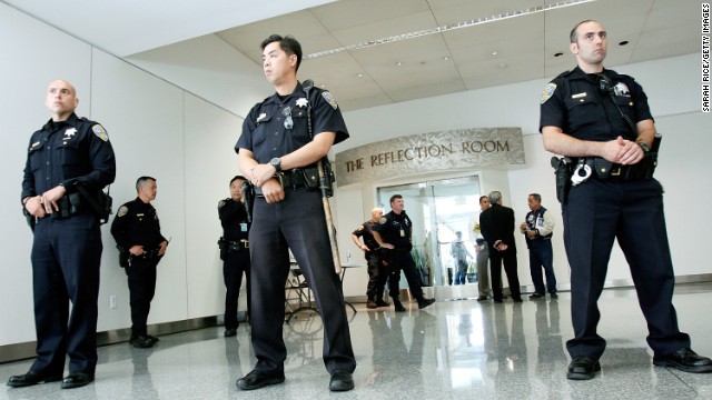 Police guard the Reflection Room at the San Francisco airport's international terminal, where passengers from Asiana Airlines Flight 214 were reportedly gathering after the crash landing on July 6.