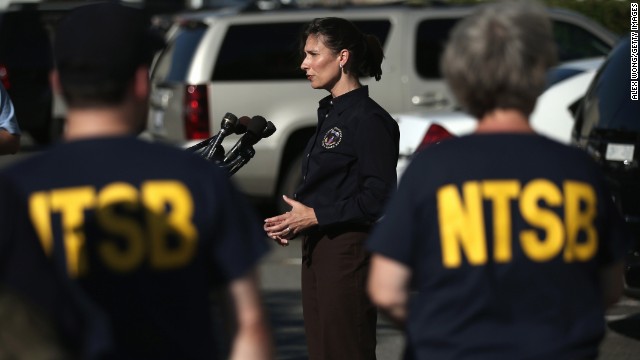 Deborah Hersman, chairwoman of the National Transportation Safety Board, speaks to the press at Reagan National Airport in Arlington, Virginia, before departing for San Francisco with an NTSB crew on July 6 to investigate the crash site.