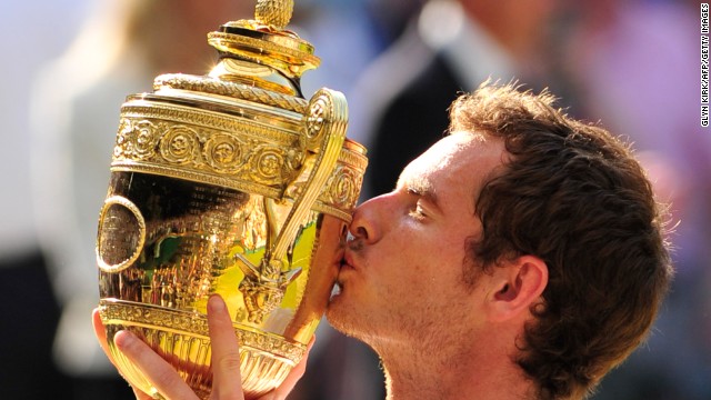 Murray gets his hands on the famous Wimbledon trophy much to the delight of a raucous Centre Court crowd.