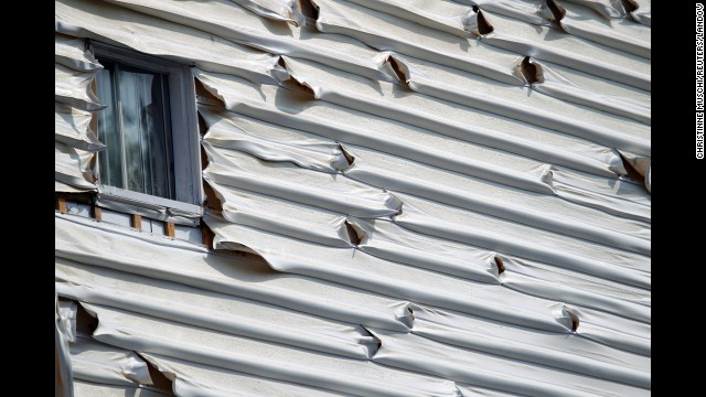 Melted siding on a home is seen near the scene of a train derailment in Lac Megantic, Quebec, July 7.