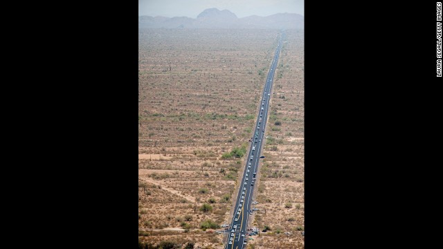 An aerial view shows the procession on the 100-mile trip from the Medical Examiner's office in Phoenix to the firefighters' home base in Prescott on July 7.