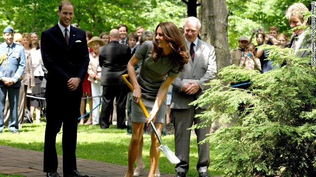 During their visit to Canada, Catherine shovels soil as Prince William looks on in July 2011 during a tree-planting ceremony in Ottawa. 