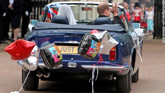 After their wedding in April 2011, the duke and duchess drive from Buckingham Palace to Clarence House in a vintage Aston Martin.