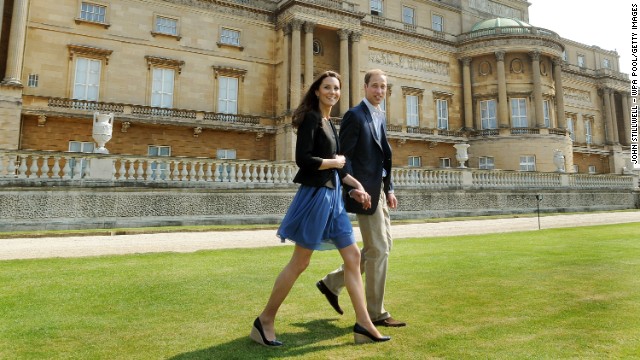 The newlyweds walk hand in hand from Buckingham Palace the day after their wedding to a waiting helicopter as they leave for a secret honeymoon location on April 30, 2011. 