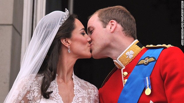 Their Royal Highnesses Prince William, Duke of Cambridge and Catherine, Duchess of Cambridge kiss on the balcony at Buckingham Palace after their wedding ceremony on April 29, 2011, in London. 